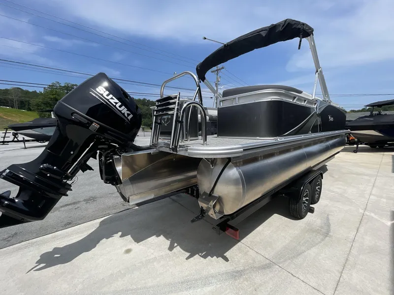 Slide: The Image of 2024 Tahoe Pontoon 25 LSZ QL with Suzuki outboard motor on trailer. - 7