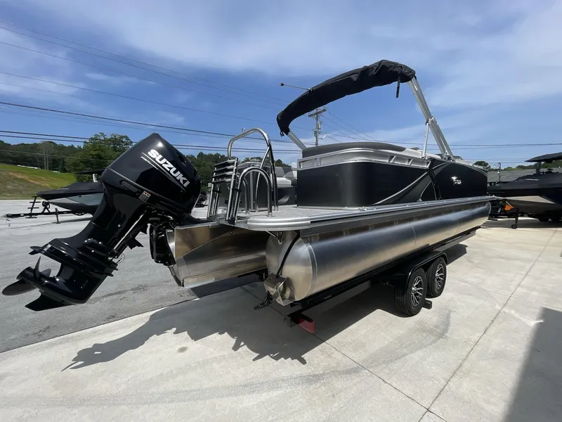 Slide: The Image of 2024 Tahoe Pontoon 25 LSZ QL with Suzuki outboard motor on trailer. - 9