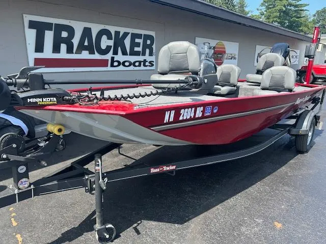 The Image of 2022 Tracker Bass Tracker Classic XL boat, red, parked outside dealership. - 0