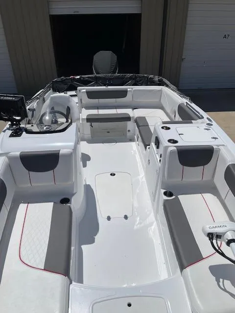 Slide: The Image of 2024 Tahoe 2150 boat interior with seating and Garmin equipment. - 5