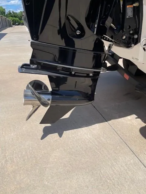 Slide: The Image of 2024 Tahoe 2150 boat motor and propeller on a sunny day. - 7