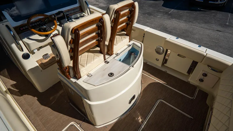 Slide: The Image of 2025 Chris-Craft Catalina 30 interior with luxurious seating and modern dashboard. - 14