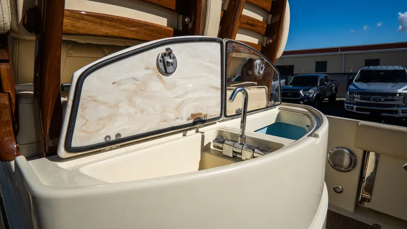 Slide: The Image of Chris-Craft Catalina 30 (2025) boat sink area with elegant design and modern fixtures. - 16