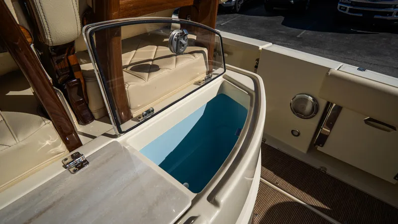 Slide: The Image of 2025 Chris-Craft Catalina 30 boat interior with open storage compartment. - 17