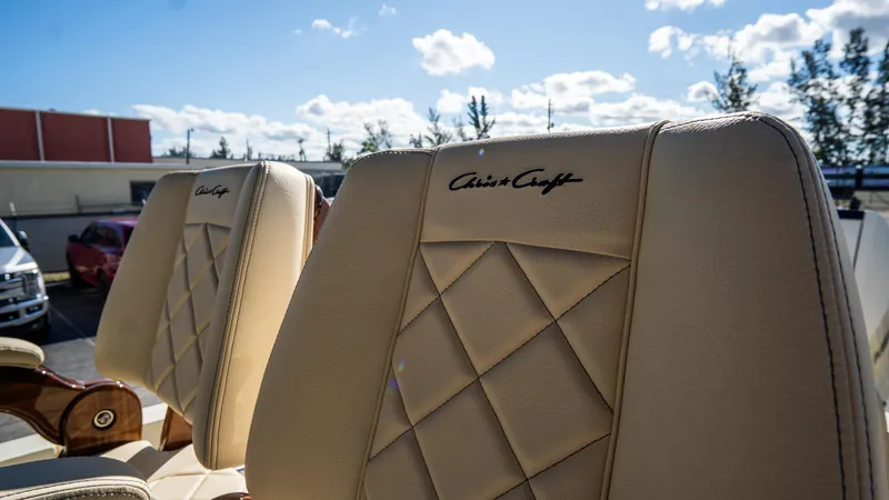 Slide: The Image of 2025 Chris-Craft Catalina 30 seats with diamond stitching under a sunny sky. - 22