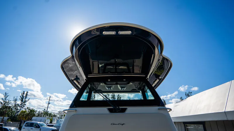 Slide: The Image of 2025 Chris-Craft Catalina 30 boat under clear blue sky. - 37