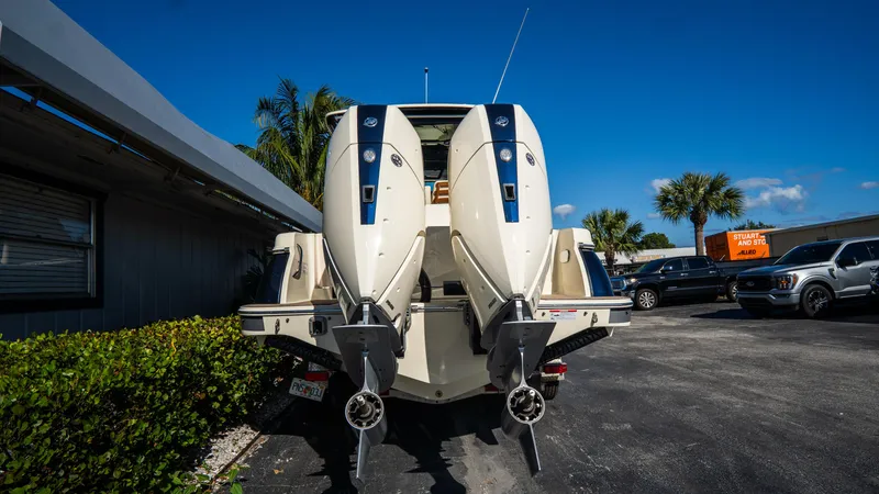 Slide: The Image of 2025 Chris-Craft Catalina 30 with dual outboard engines in a parking lot. - 4