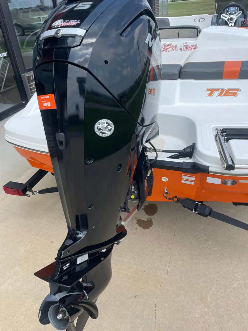 Slide: The Image of 2020 Tahoe T16 boat with powerful outboard motor, displayed on a trailer. - 3