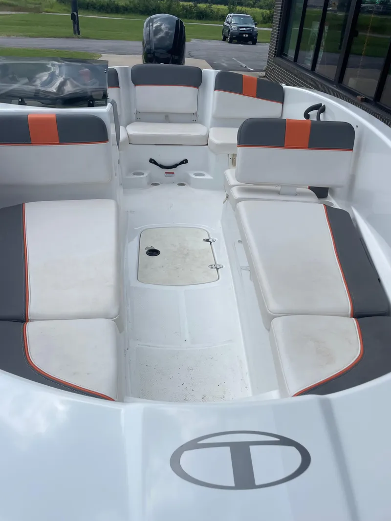 Slide: The Image of 2020 Tahoe T16 boat interior with white and gray seating, orange accents. - 5