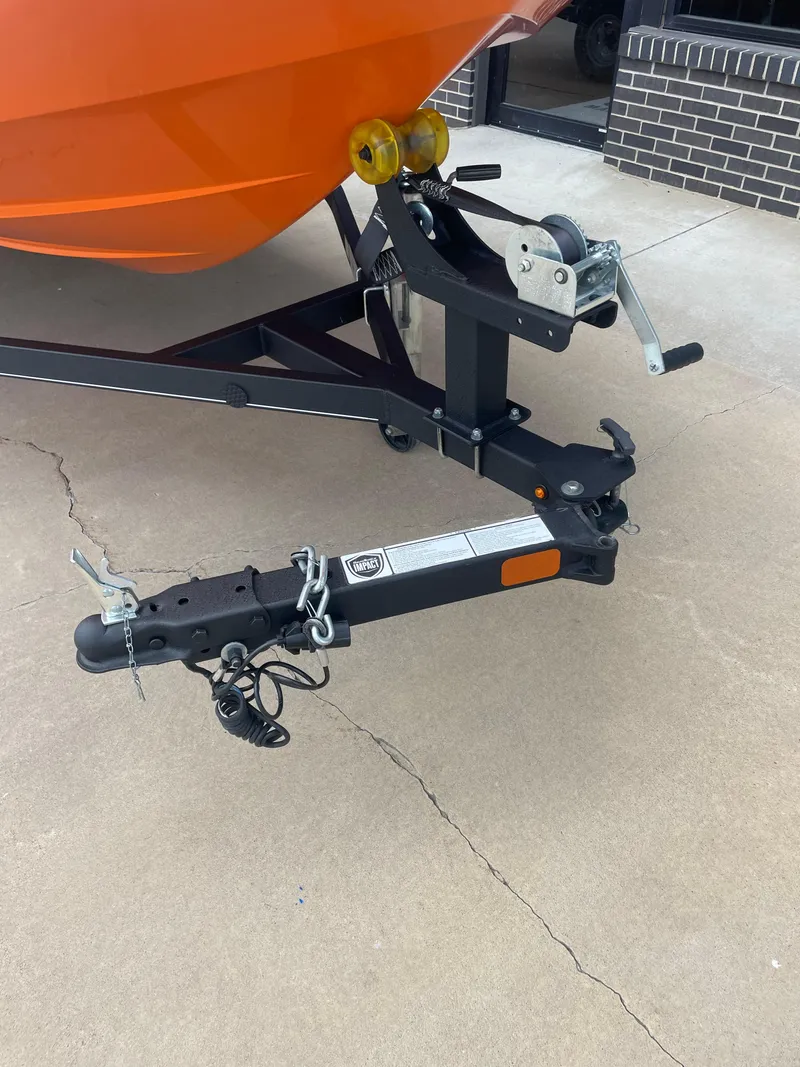 Slide: The Image of Trailer hitch of 2020 Tahoe T16 boat on concrete surface. - 6