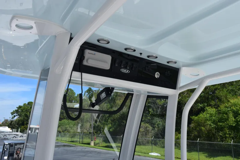Slide: The Image of 2026 Sea Hunt BX 25 FS boat console with Garmin electronics and overhead storage. - 10