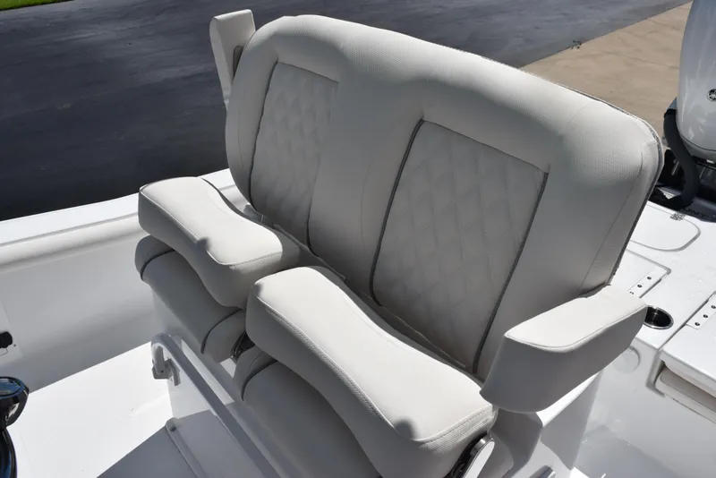 Slide: The Image of 2026 Sea Hunt BX 25 FS boat seat with cushioned armrests and diamond stitching. - 11