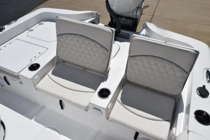 Slide: The Image of 2026 Sea Hunt BX 25 FS boat seats with cup holders and storage compartments. - 12