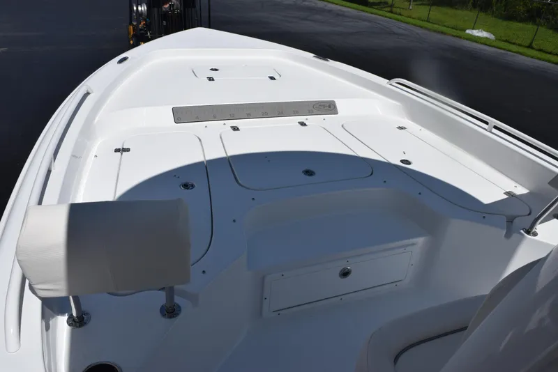 Slide: The Image of 2026 Sea Hunt BX 25 FS boat deck with storage compartments and seating. - 13