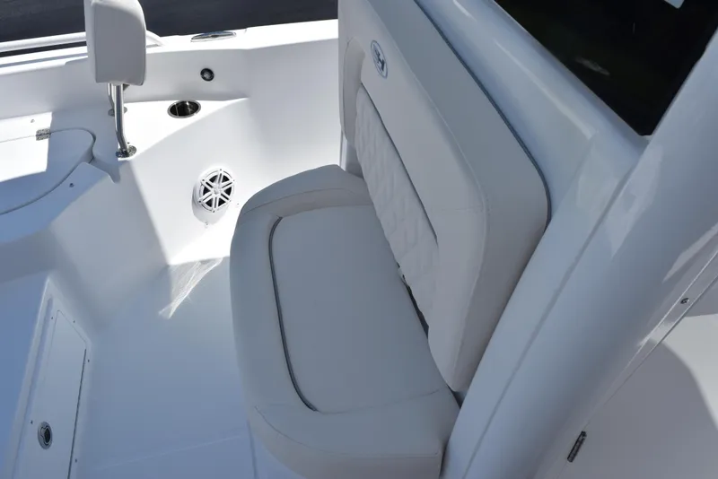 Slide: The Image of 2026 Sea Hunt BX 25 FS boat interior with cushioned seating and speaker. - 14