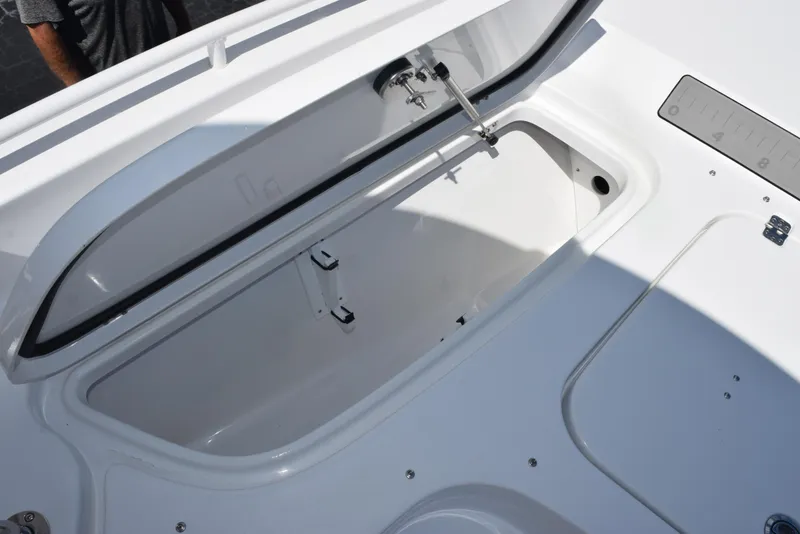 Slide: The Image of Open storage compartment on 2026 Sea Hunt BX 25 FS boat. - 17