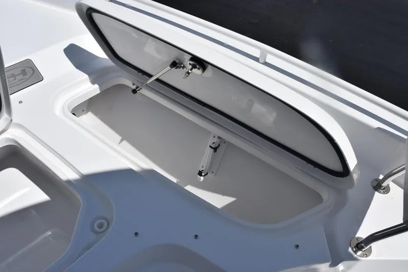 Slide: The Image of Open storage compartment on 2026 Sea Hunt BX 25 FS boat. - 19