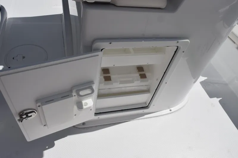 Slide: The Image of Open storage compartment on 2026 Sea Hunt BX 25 FS boat, showcasing interior space. - 21
