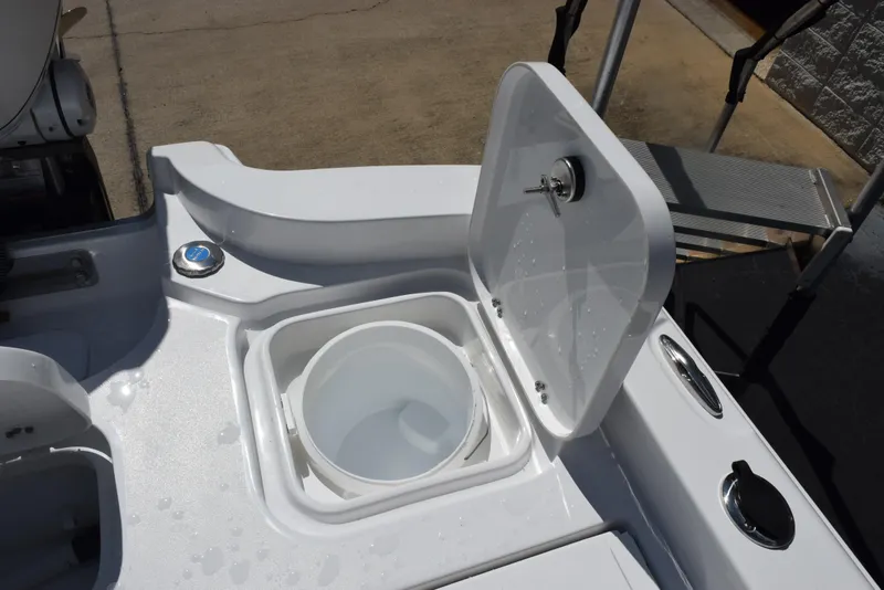 Slide: The Image of Open storage compartment on 2026 Sea Hunt BX 25 FS boat deck. - 27