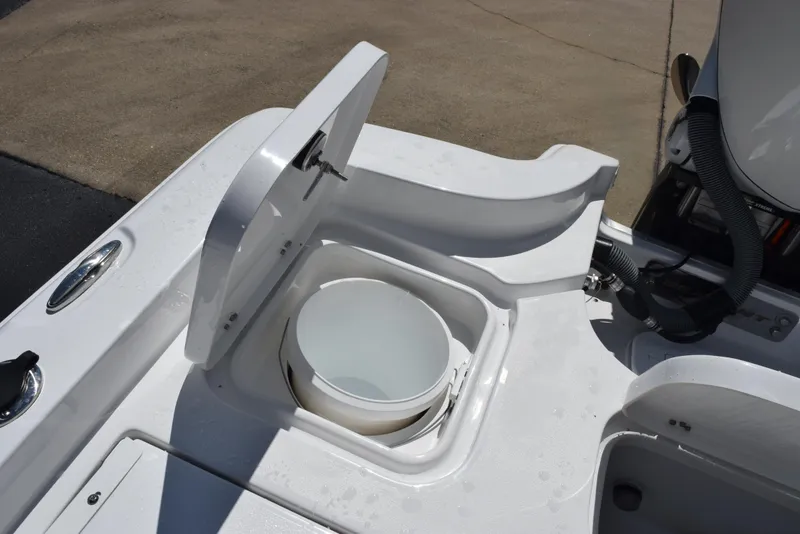 Slide: The Image of 2026 Sea Hunt BX 25 FS boat with open storage compartment and bucket. - 28