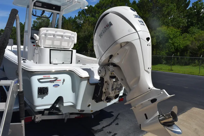Slide: The Image of 2026 Sea Hunt BX 25 FS boat with Yamaha outboard motor, parked on a sunny day. - 6
