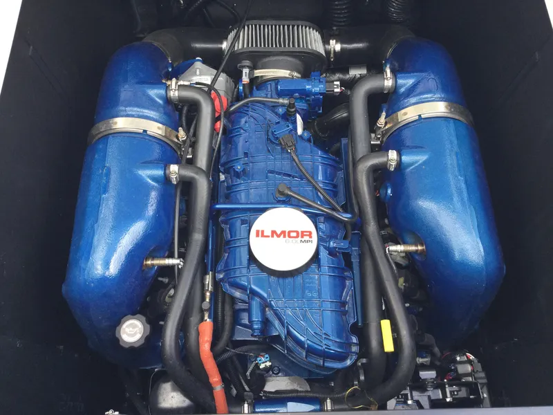 Slide: The Image of 2022 MasterCraft XT24 Ilmor engine, blue components, top view. - 12