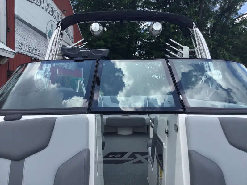 Slide: The Image of 2022 MasterCraft XT24 boat with sleek design and spacious interior. - 28