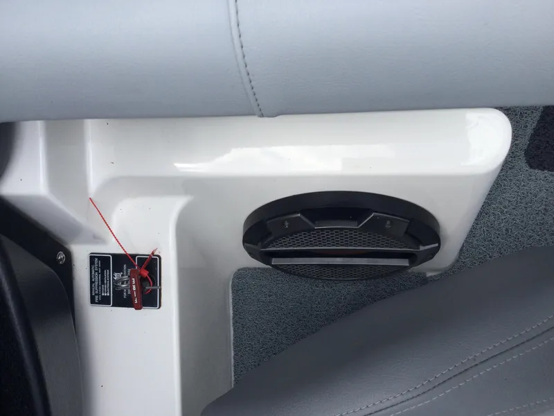 Slide: The Image of Interior of 2022 MasterCraft XT24 boat showing speaker and safety switch. - 32