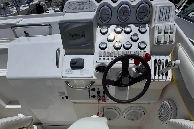 Slide: The Image of Control panel of a 1999 Black Thunder 430 powerboat with Garmin navigation system. - 4