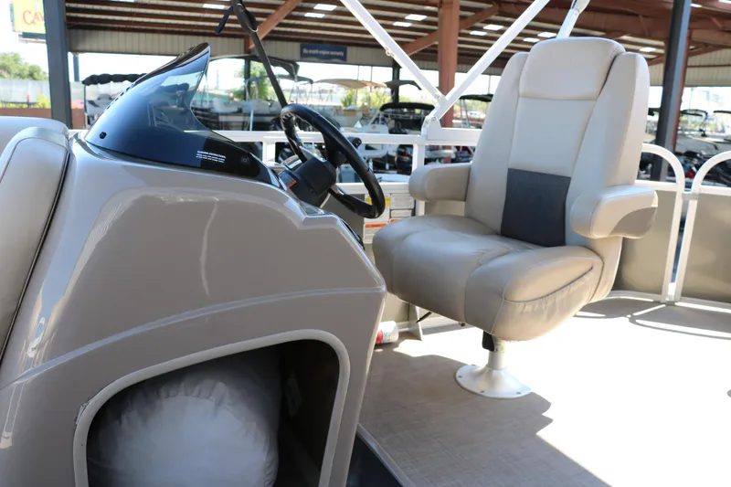 Slide: The Image of 2021 Sun Tracker Party Barge 20 DLX helm with comfortable captain's chair. - 15