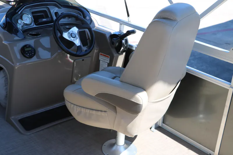 Slide: The Image of Captain's chair and helm of 2021 Sun Tracker Party Barge 20 DLX pontoon boat. - 18