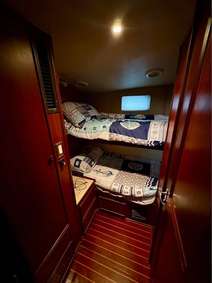 Slide: The Image of Cozy cabin with bunk beds in 1983 Hatteras 46 Convertible yacht. - 11