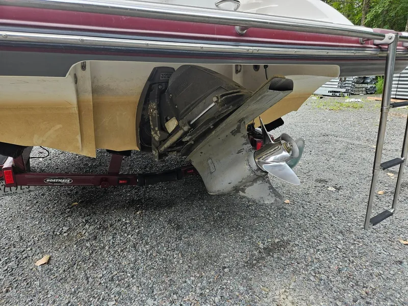 Slide: The Image of Rear view of a 2008 Bryant 233 boat with propeller and trailer. - 28
