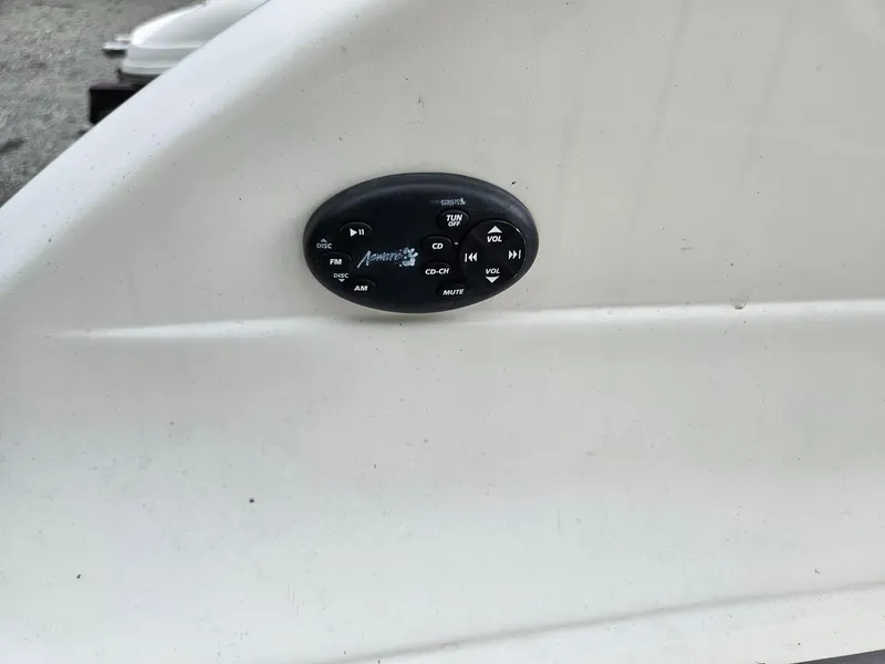 Slide: The Image of Control panel on a 2008 Bryant 233 boat dashboard. - 32