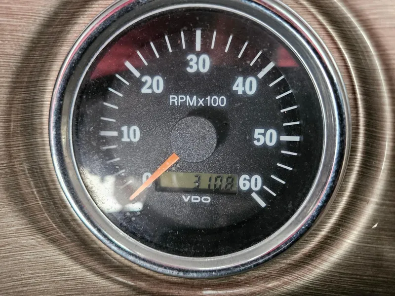 Slide: The Image of Close-up of a Bryant 233 tachometer, showing RPM at 3100, model year 2008. - 33