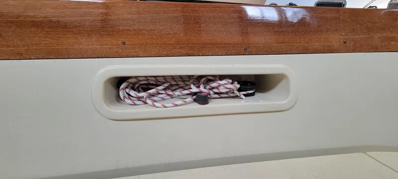 Slide: The Image of Storage compartment with rope on a 2023 C.W. Hood 32 Daysailer. - 13