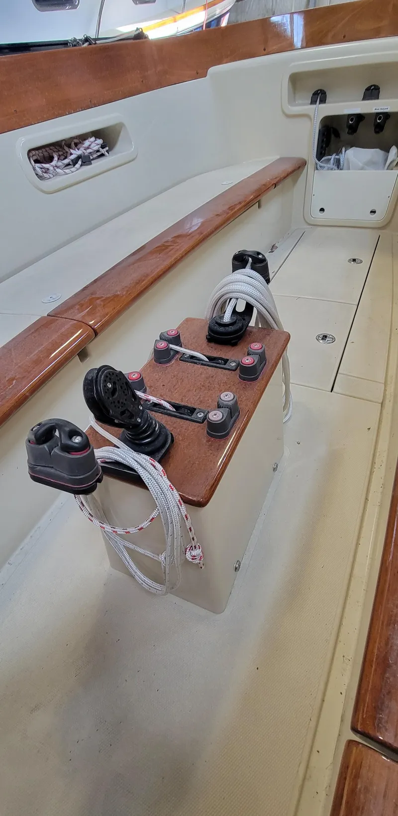 Slide: The Image of 2023 C.W. Hood 32 Daysailer interior with ropes and wooden seating. - 15