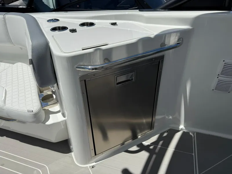 Slide: The Image of 2025 Wellcraft 38 T-Top boat interior with stainless steel storage and seating. - 23