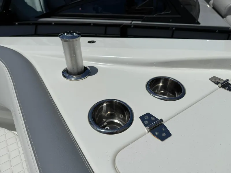 Slide: The Image of 2025 Wellcraft 38 T-Top boat detail with cup holders and stainless steel fittings. - 24