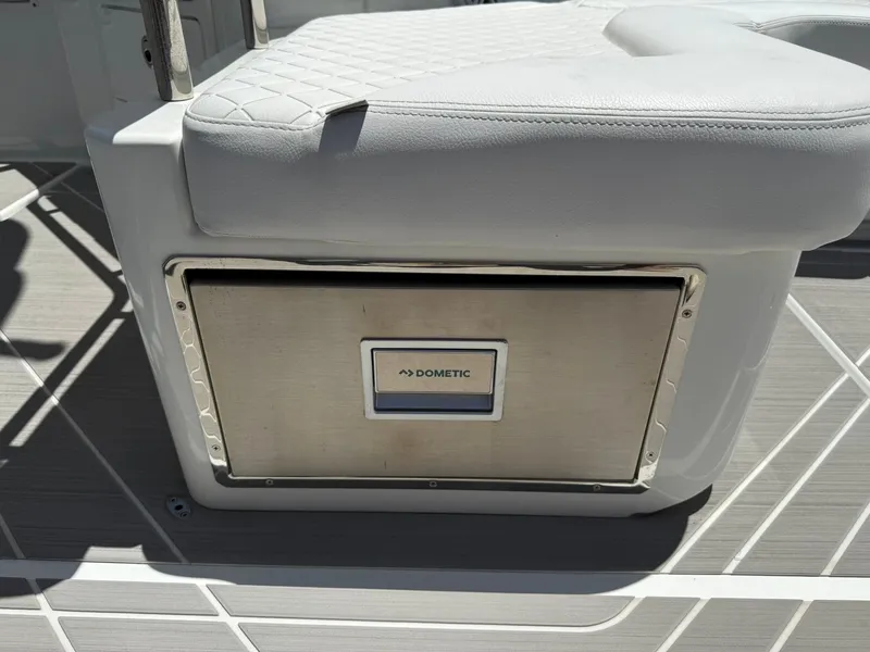 Slide: The Image of 2025 Wellcraft 38 T-Top boat seat with integrated Dometic cooler. - 28