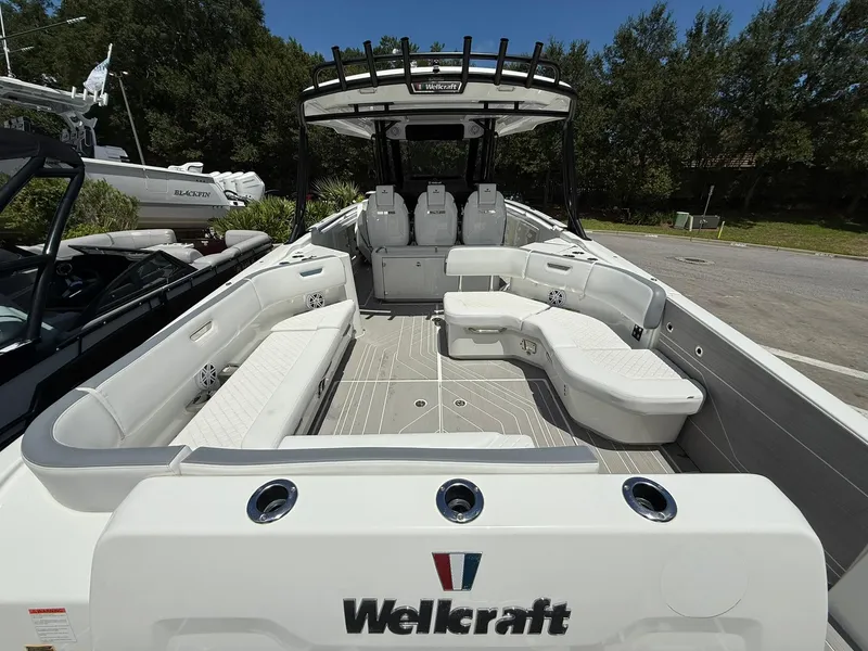 Slide: The Image of 2025 Wellcraft 38 T-Top boat interior with spacious seating and modern design. - 42