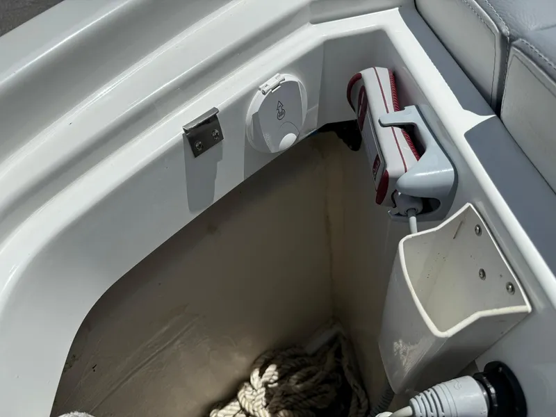 Slide: The Image of Storage compartment on a 2025 Wellcraft 38 T-Top boat, featuring ropes and equipment. - 9
