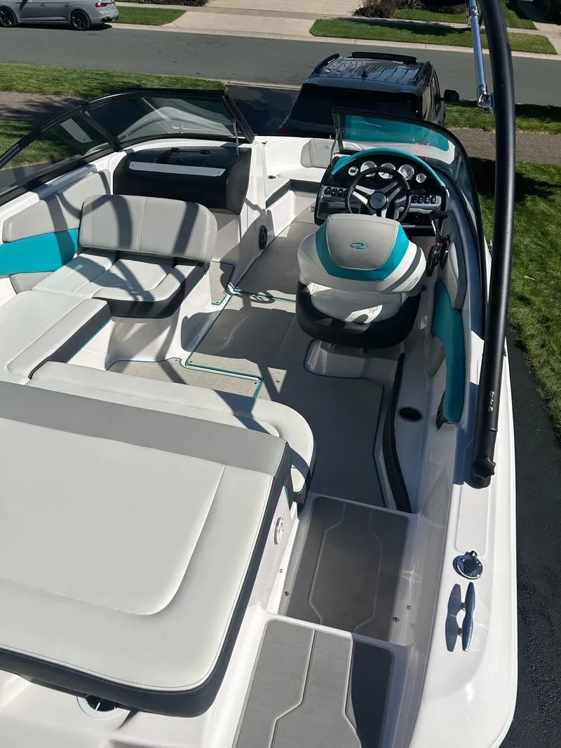 Slide: The Image of 2021 Regal 1900 ES Bowrider interior with modern seating and steering wheel. - 15
