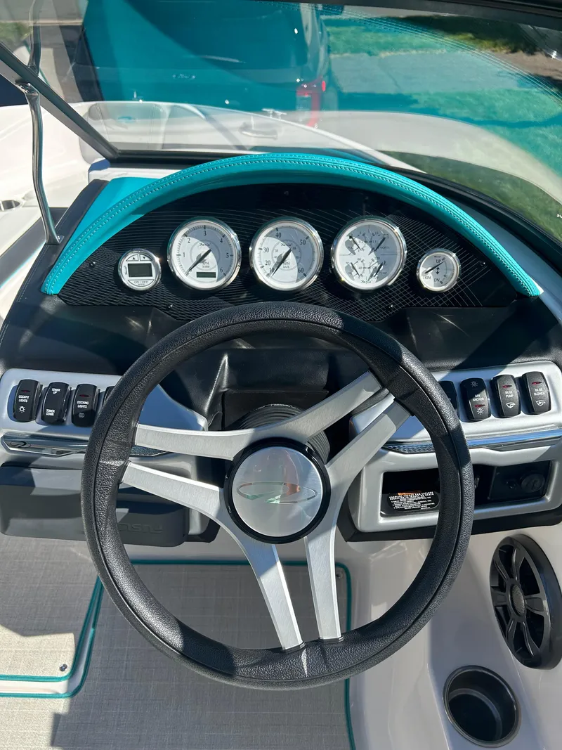 Slide: The Image of Dashboard of 2021 Regal 1900 ES Bowrider with steering wheel and gauges. - 9