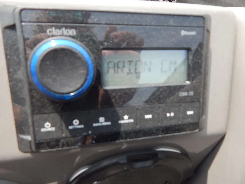Slide: The Image of Close-up of a Clarion audio system in a 2024 Qwest Splash Pad 822. - 33