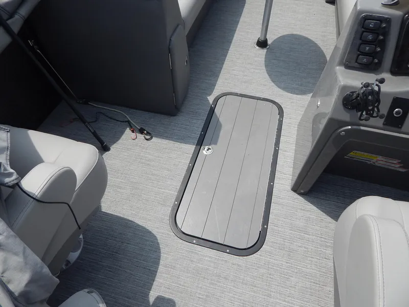 Slide: The Image of 2024 Qwest Splash Pad 822 boat interior with gray flooring and seating. - 37