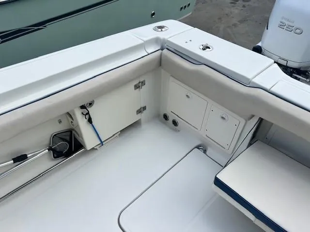 Slide: The Image of 2006 Hydra-Sports Vector 3300 CC boat interior with storage compartments and seating. - 10