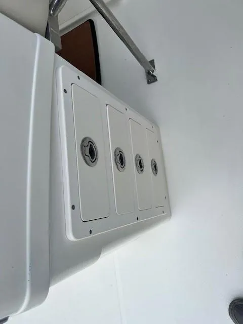 Slide: The Image of Storage compartments on a 2006 Hydra-Sports Vector 3300 CC boat deck. - 13