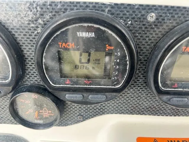 Slide: The Image of Close-up of Yamaha tachometer on 2006 Hydra-Sports Vector 3300 CC boat dashboard. - 16