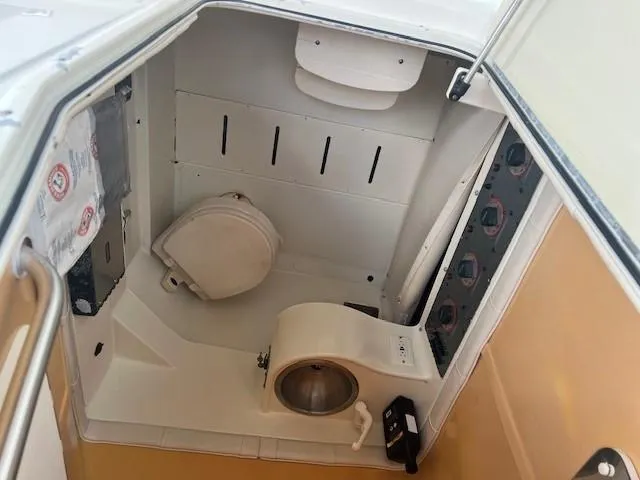 Slide: The Image of 2006 Hydra-Sports Vector 3300 CC boat interior with compact marine toilet and sink. - 20